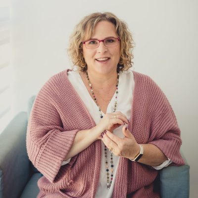 Woman demonstrates beginning EFT Tapping.