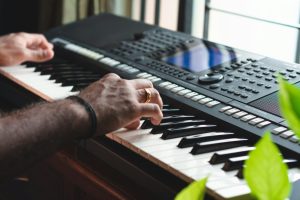 Man playing a keyboard.