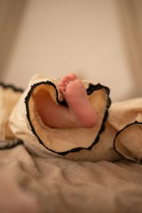 baby's feet sticking out from blanket